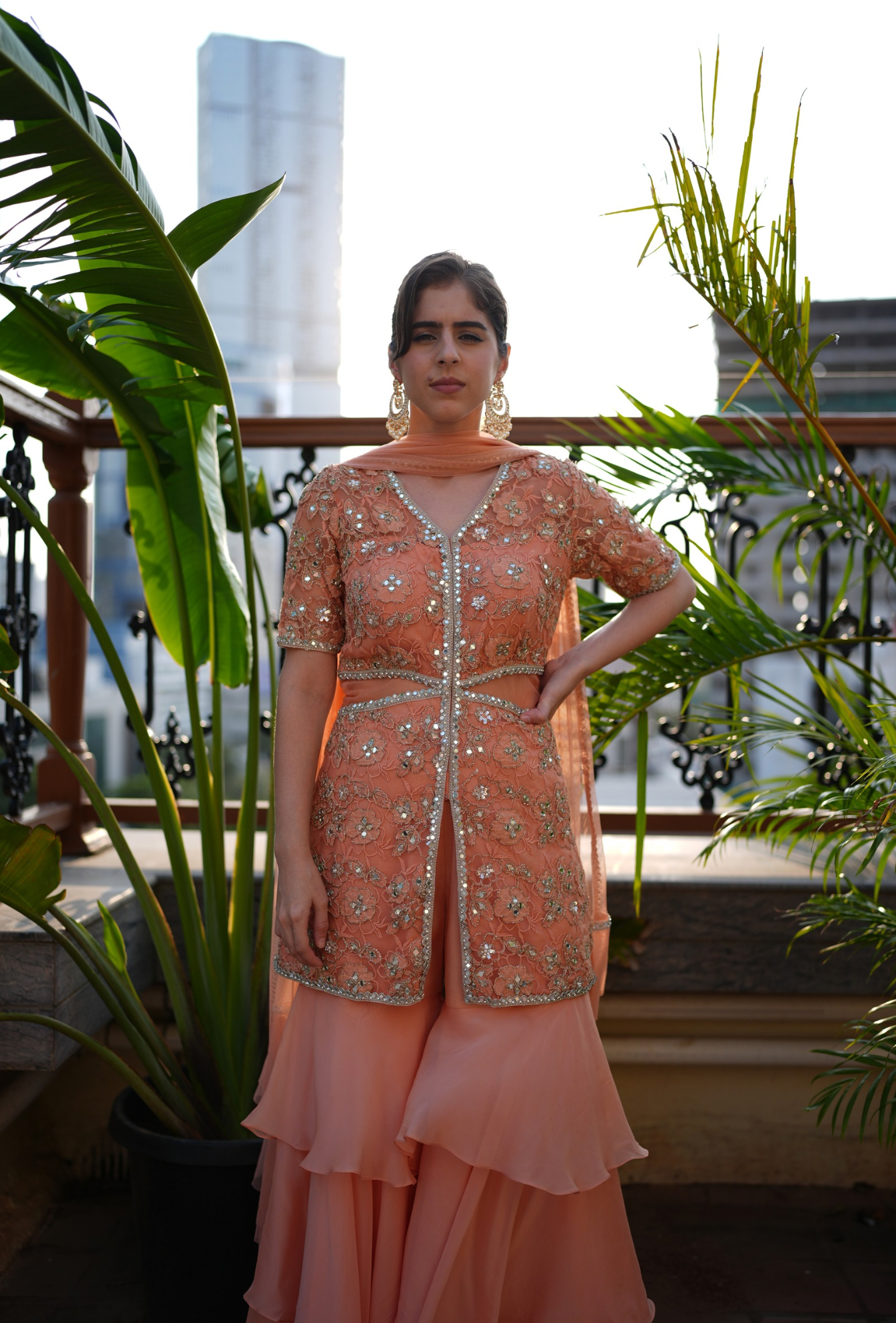 Embroidered kurta paired with a layered sharara pant.